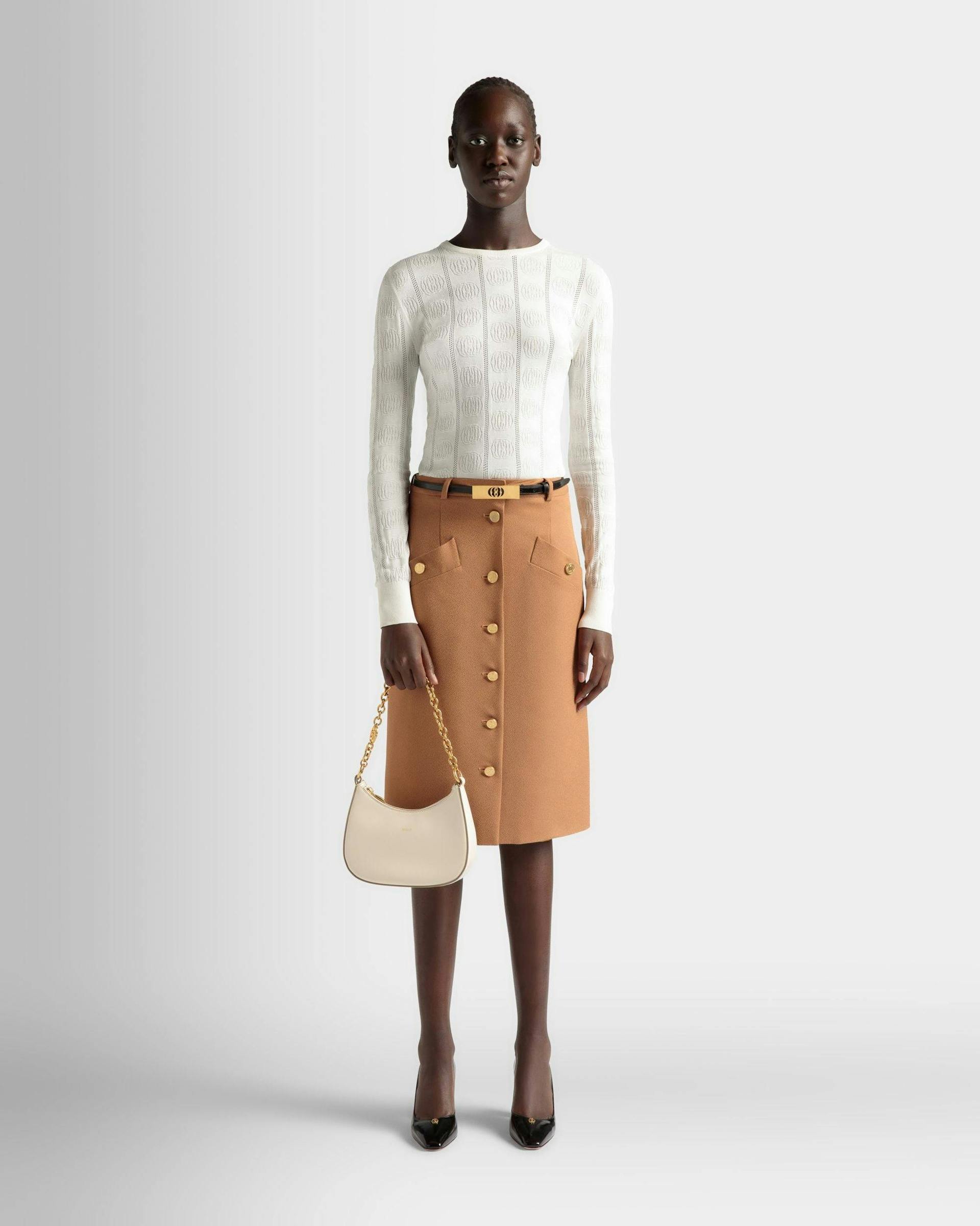 Women's Emblem Mini Crossbody Bag In White Patent Leather | Bally | On Model Front