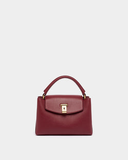 Lock Me Small Top Handle Bag in Ruby Red Grained Leather